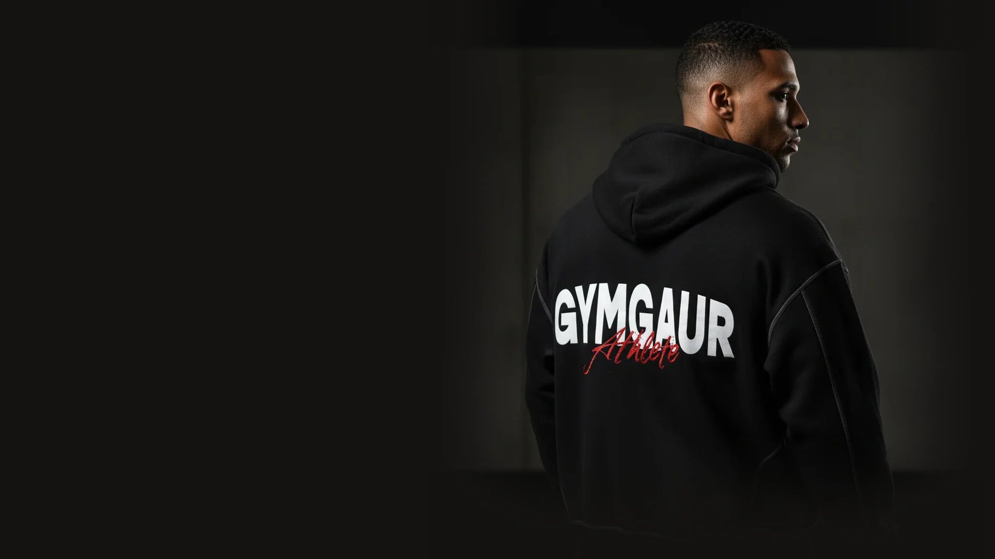 Athlete in a black GYMGAUR hoodie, seen from behind